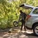A photo of someone loading a RadTrike into their car.